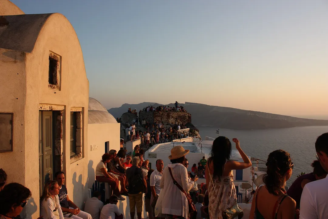 White cliffside buildings of Oia overlooking the Santorini caldera
