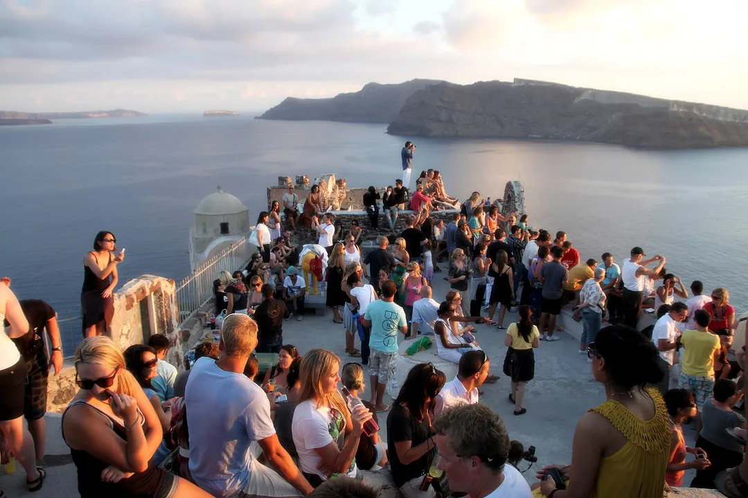 Sunset over the Santorini caldera seen from a cliffside terrace